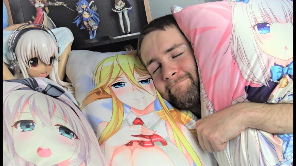 Man hugging a pillow with anime caracters